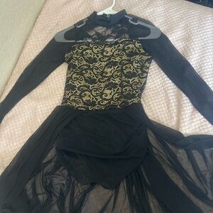 Kids black and gold lace turtle neck dance leotard with sheer black sleeves